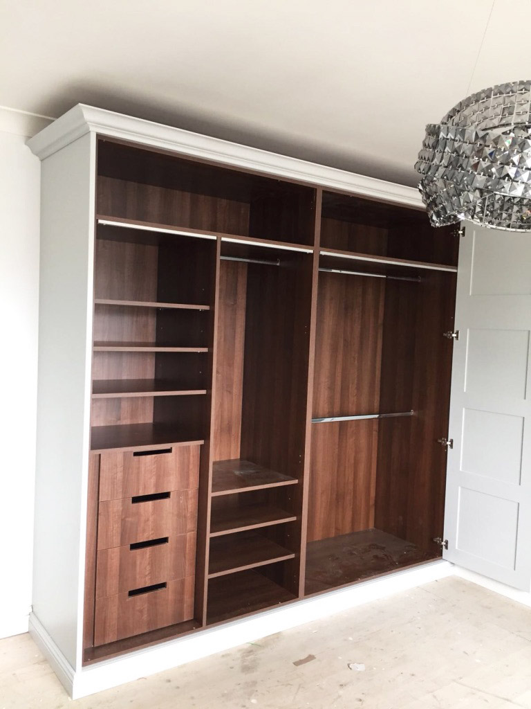 white and dark wood fitted wardrobe